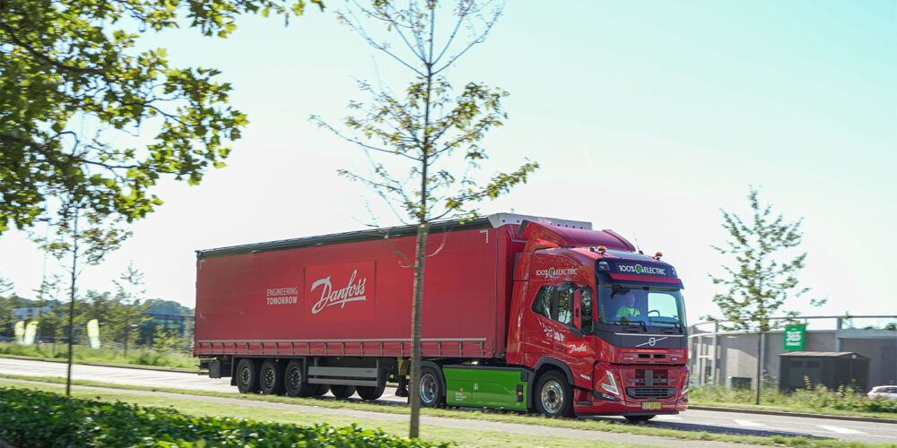The new 24-hour e-trucks will run between Danfoss sites in Denmark, utilizing custom superchargers for quick battery charging during stops.